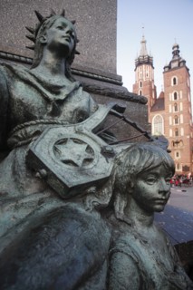 Poland, Krakow, Detail of female figure & child on monument to the polish romantic poet Adam