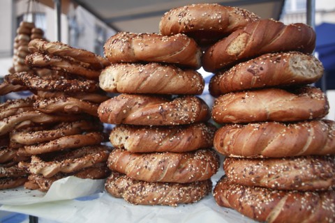 Poland, Krakow, Obwarzaneck, twisted rings of bread strewn with poppy sale for sale from street