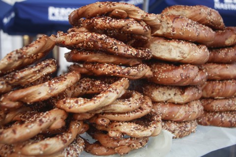 Poland, Krakow, Obwarzaneck, twisted rings of bread strewn with poppy sale for sale from street
