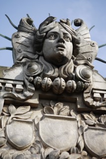 Poland, Krakow, Head of Apollo on top of the entrance to the Palace of Arts built in 1901 for the