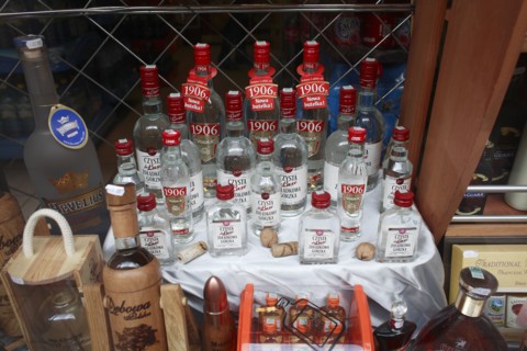 Poland, Krakow, display of vodka in shop front.