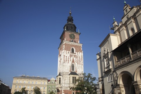 Poland, Krakow, Old Town Hall in the Rynek Glowny market square with part of the Cloth Hall to the