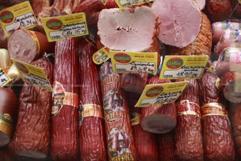 Poland, Krakow, display of cold meats in Stary Kleparz market.
