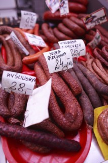 Poland, Krakow, display of cold meats in Stary Kleparz market.