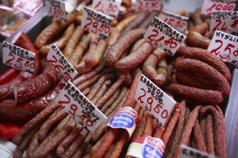 Poland, Krakow, display of cold meats in Stary Kleparz market.