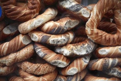 Poland, Krakow, Obwarzaneck, twisted rings of bread strewn with poppy sale for sale from street