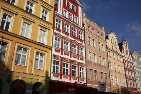 Poland, Wroclaw, pastel coloured building facades in the Rynek old town square.