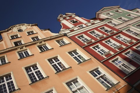 Poland, Wroclaw, pastel coloured building facades in the Rynek old town square.