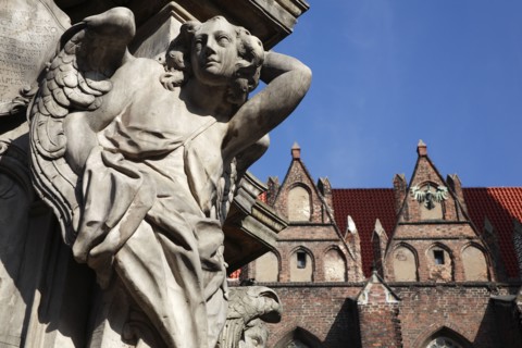 Poland, Wroclaw, Ostrow Tumski, detail of figure at base of baroque monument to the Catholic Martyr