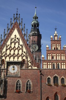 Poland, Wroclaw, Town Hall with sundial & decorative gable & the clock tower of the Municipal