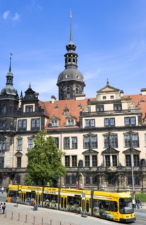 GERMANY, Saxony, Dresden, A yellow tram in the road in front of the Residenzschloss with people