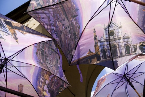 ITALY, Tuscany, Florence, Souvenir stall on the Ponte Vecchio Bridge selling umbrellas with scenes