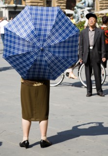 ITALY, Tuscany, Florence, Elderly senior Asian tourist couple in Piazza della Signoria with the