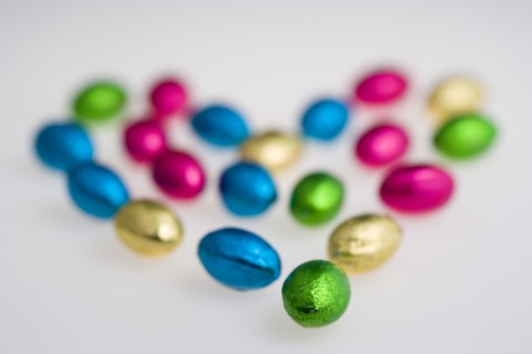 Food, Sweets, Chocolate, Colourful foil wrapped Easter eggs in the shape of a Valentine heart on a