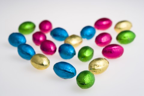 Food, Sweets, Chocolate, Colourful foil wrapped Easter eggs in the shape of a Valentine heart on a