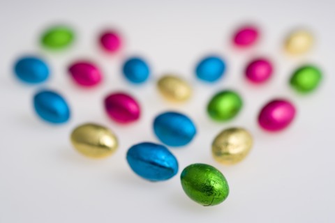 Food, Sweets, Chocolate, Colourful foil wrapped Easter eggs in the shape of a Valentine heart on a