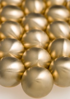 Industry, Machinery, Components, Brass metal lathe turned ball bearings.