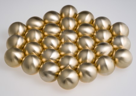 Industry, Machinery, Components, Brass metal lathe turned ball bearings arranged in a hexagon shape