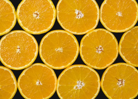 Food, Fruit, Oranges, Overhead view of group of oranges cut in half showing core and segments