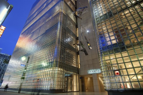 Japan, Honshu, Tokyo, Ginza, nightime view of Hermes Building looking out of alley towards