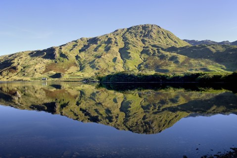 IRELAND, County Galway, Connemara, Kylemore Lough with Benbaun Mountain behind.