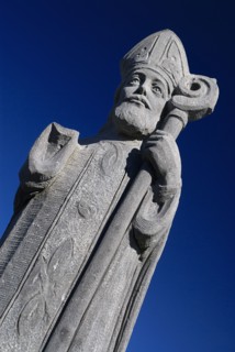 IRELAND, County Mayo, Downpatrick Head, Statue of St Patrick, who prayed frequently in the church.