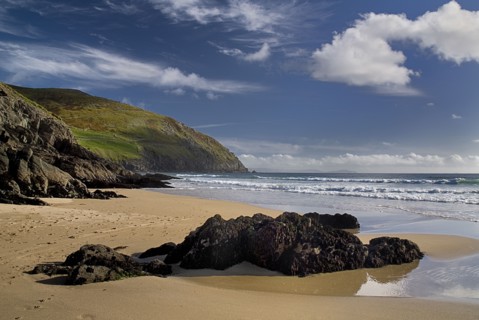 IRELAND, County Kerry, Dingle Peninsula, Coumeenole Beach at Slea Head  Incoming waves with rocks