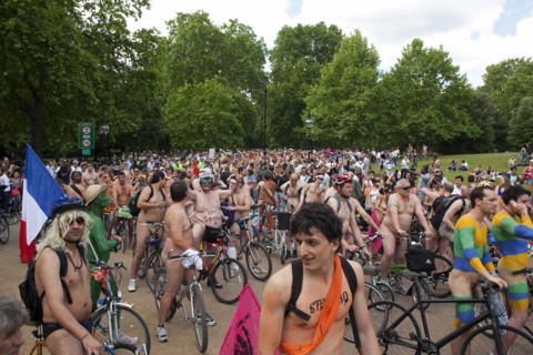 ENGLAND, London, Hyde APrk, Naked people riding their bicycles on formation at Hyde Park while