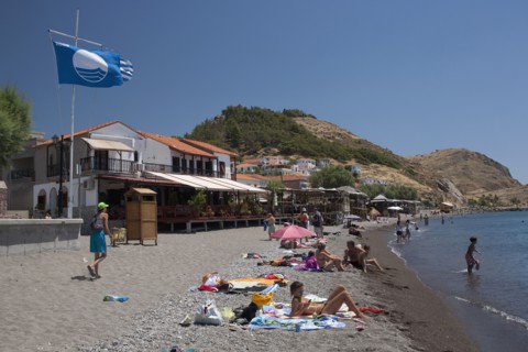 GREECE, North East Aegean, Lesvos Island, Eresos, View of beach with people sunbathing and swimming