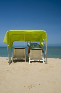 VENEZUELA, Margarita Island, Playa Caribe, View of a green tent at the Playa Caribe beach with a