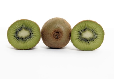 FOOD, Fruit, Kiwifruit, Whole and section through kiwi showing seeds and flesh.
