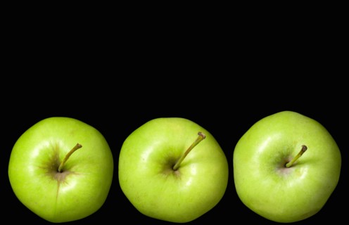 Food, Fruit, Apples, Three ripe green apples in a line seein from above showing the storks or stems