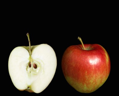 Food, Fruit, Apples, Two ripe red apples with one whole and one cut in half to show the core seeds