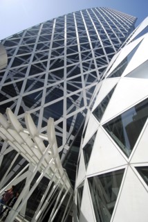Japan, Tokyo, Shinjuku, New Cocoon Building, unusual shape and design, young couple coming out of