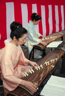 Japan, Tokyo, Meguro, beside the Meguro-gawa river, two women dressed in traditional kimonos