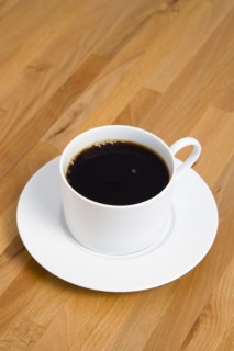 Drinks, Hot, Coffee, Cup and saucer of hot black coffee on a wooden table.