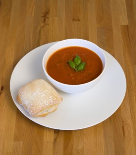 Food, Cooked, Soup, Bowl of tomato and basil soup on a plate with a rustic bread roll on a wooden