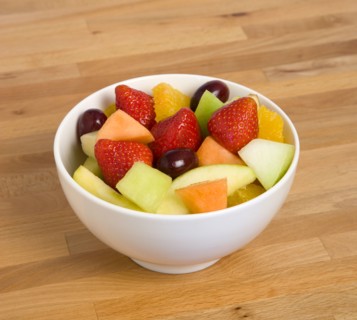 Food, Fruit, Salad, White bowl of fresh fruit salad on a wooden table top.