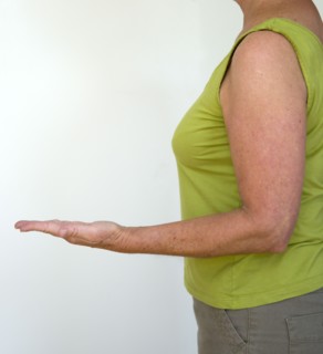 Health, Body, Arms, Woman in profile from side with arm bent at elbow with palm of hand facing