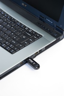 Industry, Computers, Components, 8 gigabyte USB portable flash storage device inserted into laptop