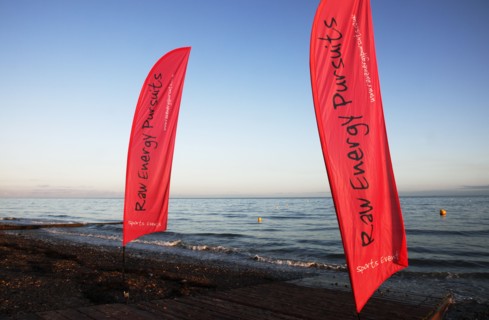 England, West Sussex, Goring-by-Sea, Worthing Triathlon 2009,  Flags marking start of the swim