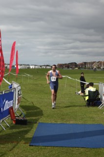 England, West Sussex, Goring-by-Sea, Worthing Triathlon 2009, male competitor approaching finish