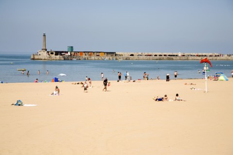 England, Kent, Margate beach with sunbathers.