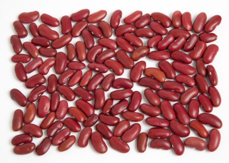 Food, Uncooked, Beans, Red kidney beans scattered on a white surface.