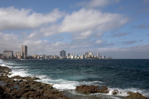 Cuba, Havana, Vedado, Malecon, View across the sea toward the city skyline.