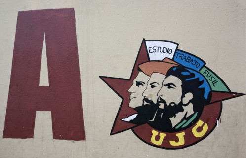 Cuba, Havana, Centro Habana, Painting of Che Guevara along with two other portraits inside a