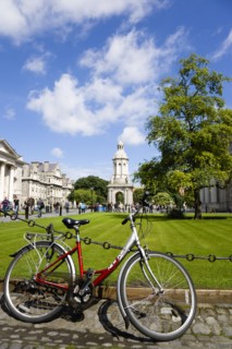 Ireland, County Dublin, Dublin City, Trinity College university with people walking through