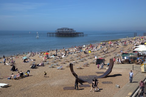 England, East Sussex, Brighton, view over the pebble beach with modern sculpture in the foreground