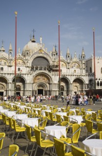 Venice, Veneto, Italy. Centro Storico St. Marks Square Cafe tables prepared for customers in early