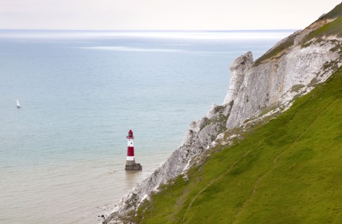 Eastbourne, East Sussex, England. Beachy Head view of the lighthouse at the base of the chalk